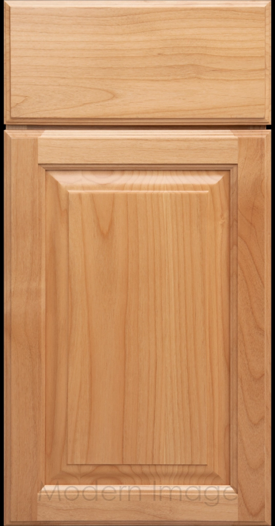Natural stained Hampton raised panel kitchen cabinets with flat slab drawer fronts.